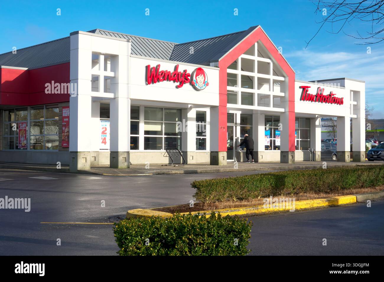 A customer entering a Wendy`s restaurant in Maple Ridge, B. C., Canada. Stock Photo